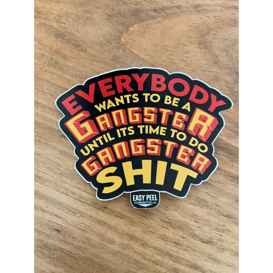 Sticker showcasing bold text reading Everybody wants to be a gangster on Gangster S**t product