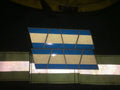 Geometric ceiling panel featuring blue and white stripes from BLACKED OUT BLUE AND GREY TRIPLE STRIPE REFLECTIVE HELMET TETRAHEDRON 8 PACK