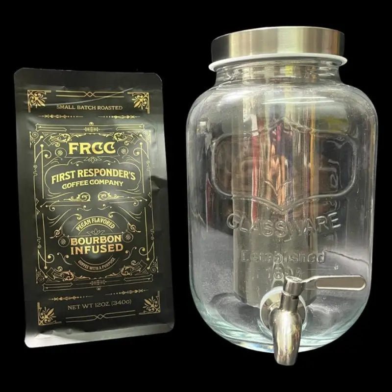 Glass beverage dispenser with metal spigot next to bourbon-infused coffee and Cold Brew Jar