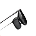 Black Glorietta sunglasses with thin frames, featuring free lens design, side view