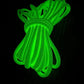 Coiled neon green Glow Dacron® rope with enhanced resistance in an emergency pack