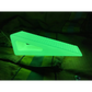 Glowing neon-green triangular door stopper made of high durometer silicone for extreme grip