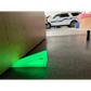 Neon green Glow - Extreme Grip doorstop wedge on floor made of high durometer silicone