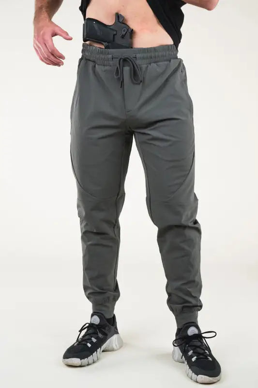 Gray Carrier Traveler Joggers with concealed carry gun in waistband for effortless style