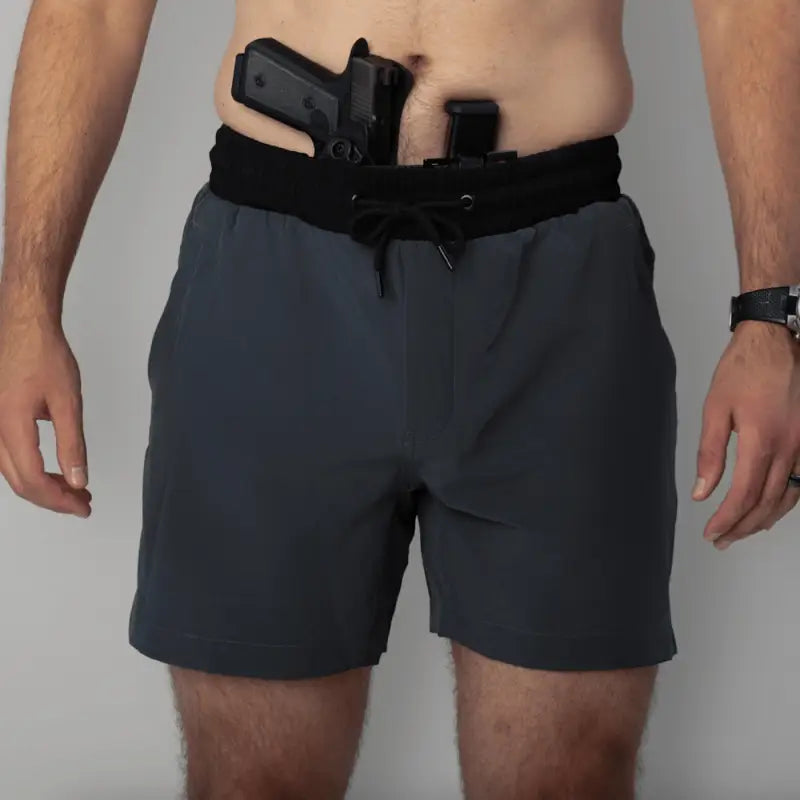 Gray carrier training shorts with concealed carry firearm and 5-inch inseam