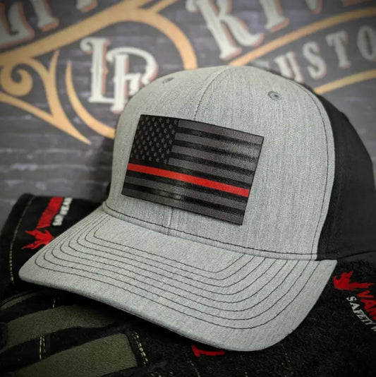 Gray and black baseball cap with a red line leather patch featuring a thin red line flag