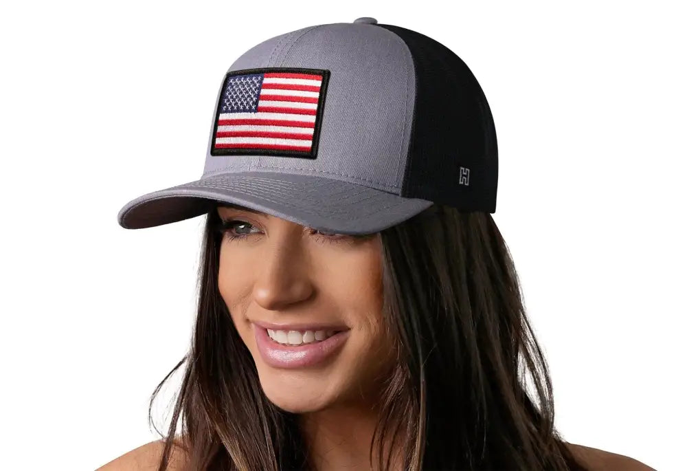 Gray and black USA snapback featuring an American flag trucker patch design