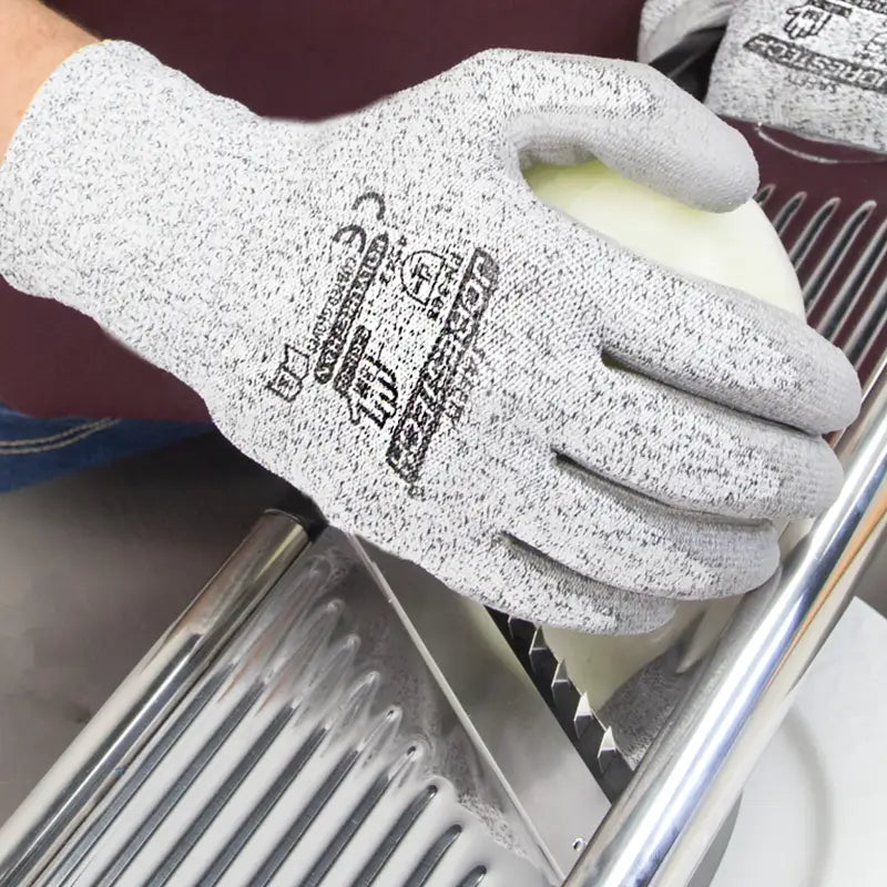 Gray cut-resistant safety work gloves with polyurethane dipped palms for optimal finger dexterity