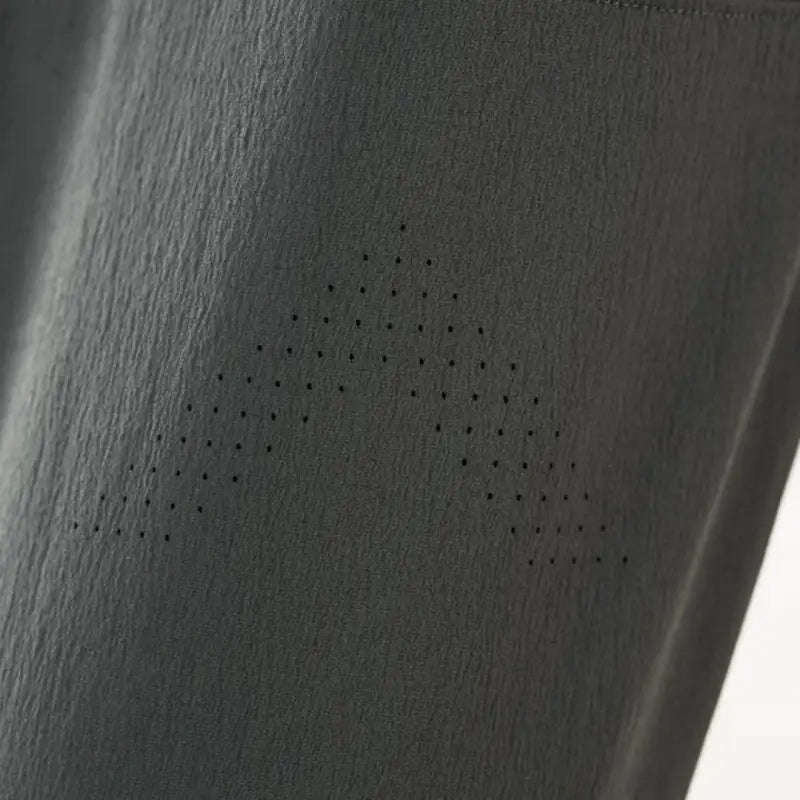 Gray fabric with perforated design on Carrier Traveler Joggers featuring concealed carry and carrier retention waistband