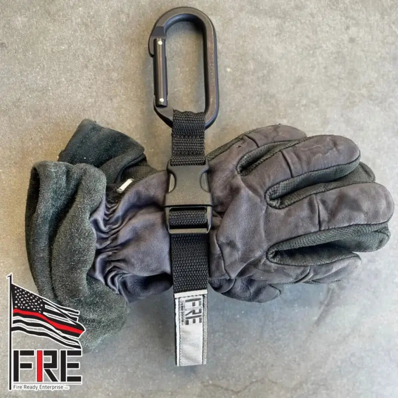 Gray firefighting glove with SMC Black Oval Carabiner for a secure glove strap