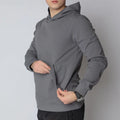 Gray hooded sweatshirt featuring a durable hoodie, hand pocket, and smooth draws for comfort