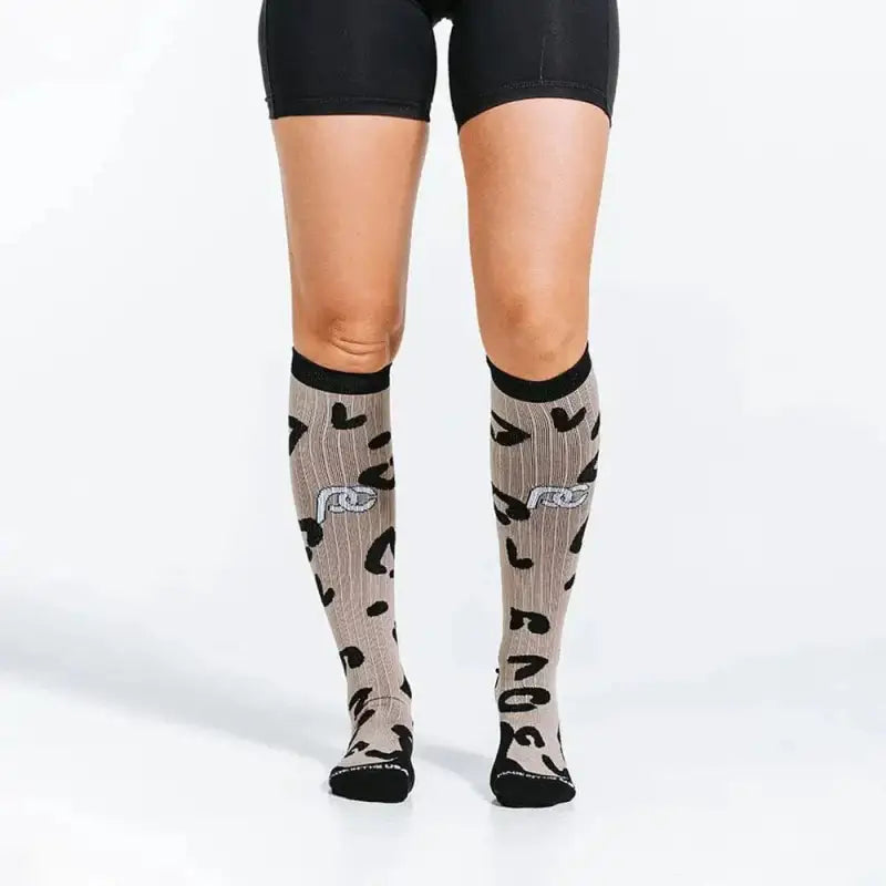 Gray knee-high socks with black hearts and logo, perfect for Marathon Leopard and first responders