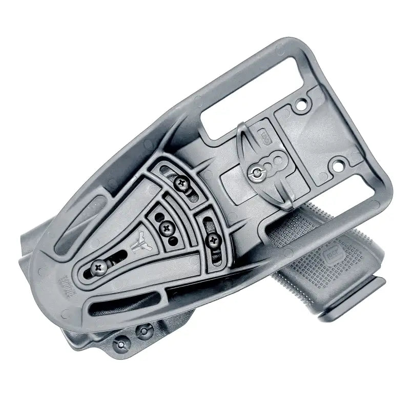 Gray polymer gun holster for Glock 19 with Nightstick TCM-10 weapon lights competition holster
