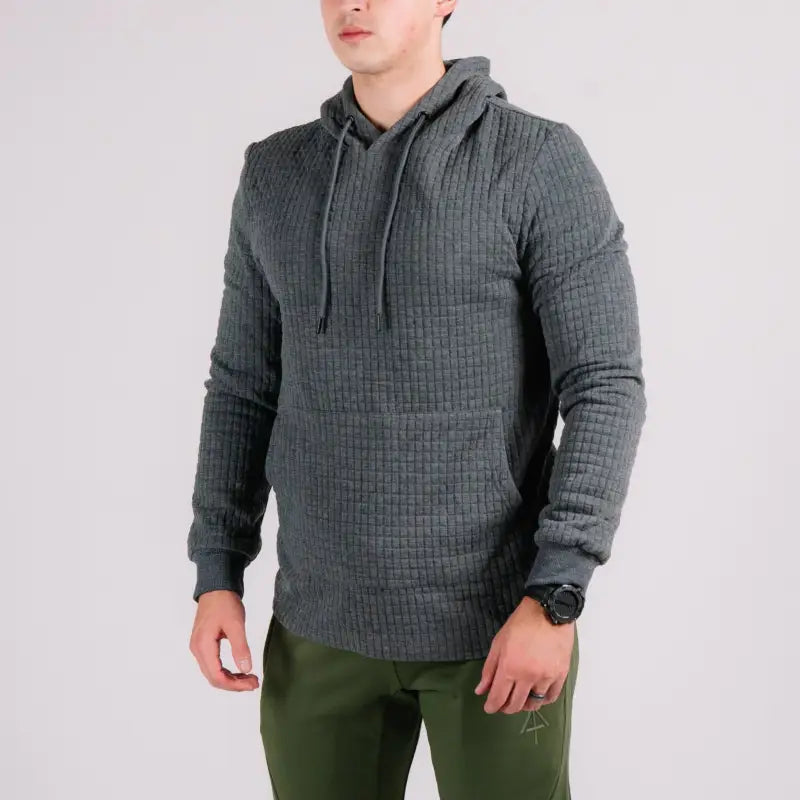 Gray quilted hoodie with hand pocket showcasing the Standoff Concealment Hoodie Mk.II design