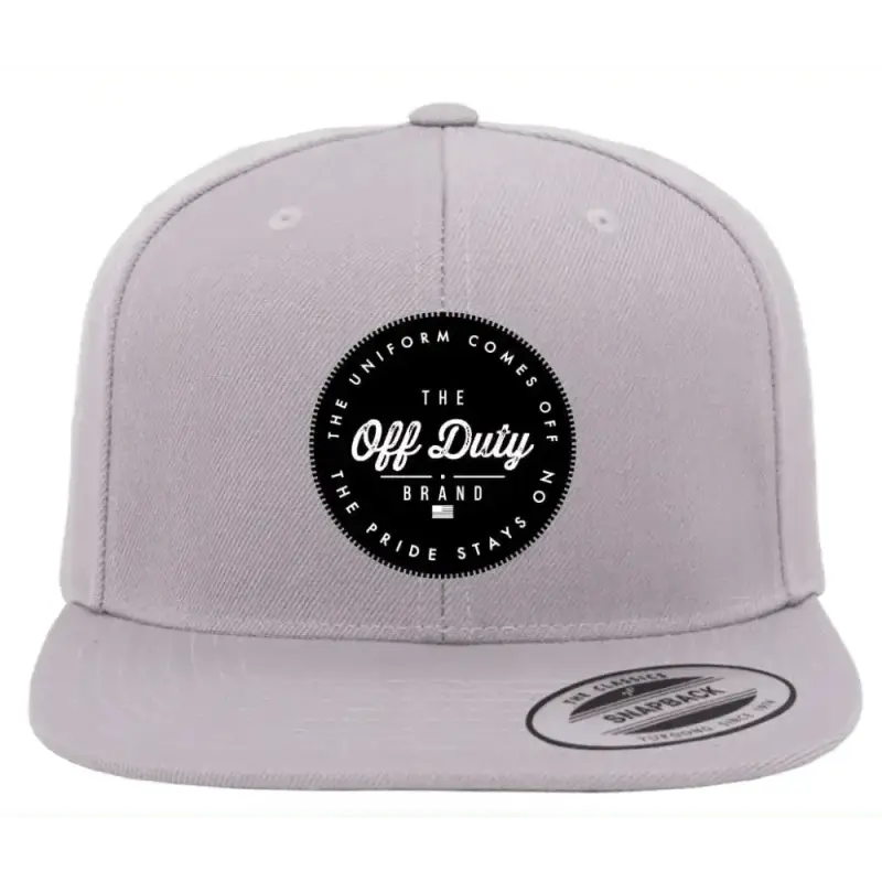 Gray snapback hat featuring black Off Duty brand logo patch, perfect for the Duty Essential Snapback