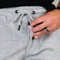 Gray drawstring sweatpants with patented carrier retention waistband for comfortable wear