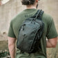 Gray tactical sling backpack worn on back, ideal for BLINDSIDE - Concealed Carry Sling