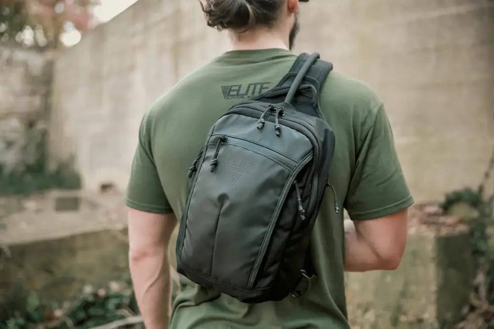 Gray tactical sling backpack worn on back, ideal for BLINDSIDE - Concealed Carry Sling