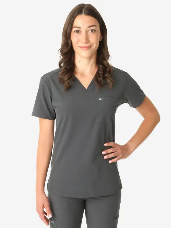 Gray V-neck women’s tuckable one-pocket scrub top with short sleeves for medical professionals