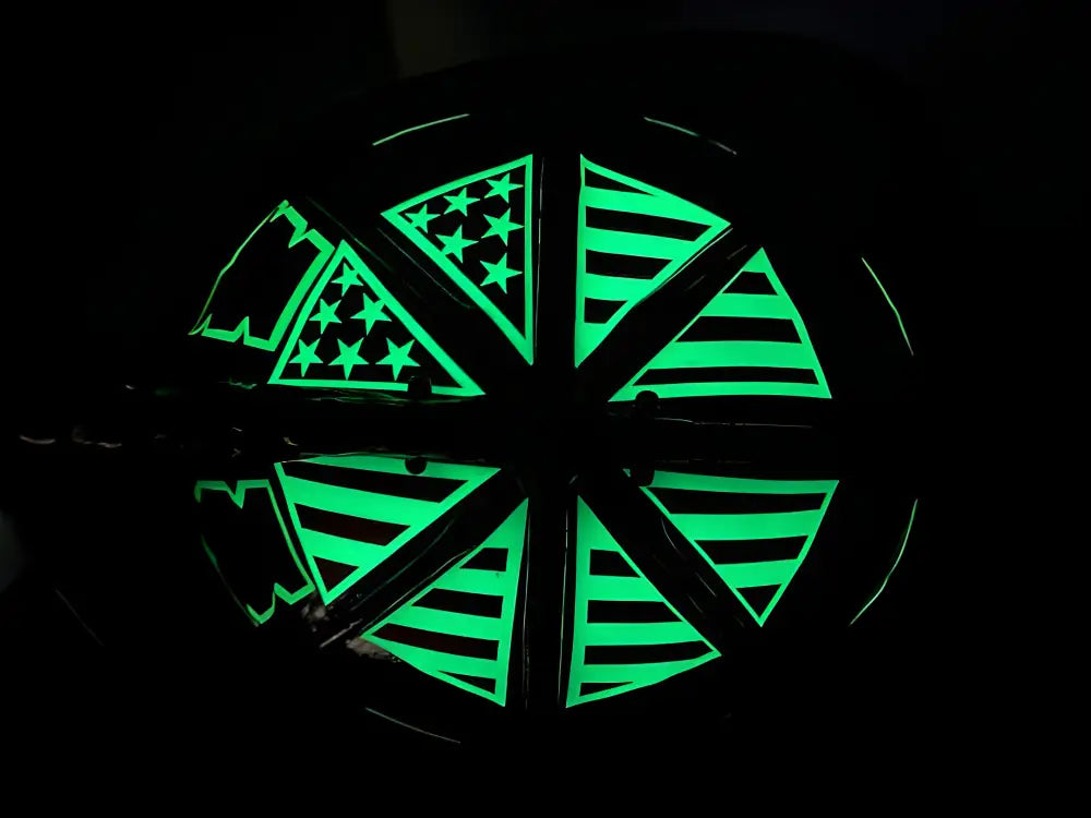 Glowing green American flag helmet decals in a circular pinwheel design