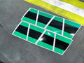 Green and black striped geometric pattern for BLACK TRIPLE STRIPE REFLECTIVE HELMET