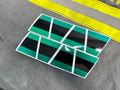 Green and black triple stripe reflective stickers in a geometric pattern for a helmet