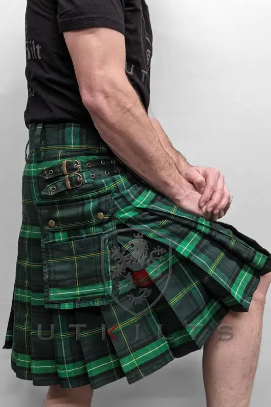 Green and black tartan utility kilt with buckle straps and pleats for a Celtic look