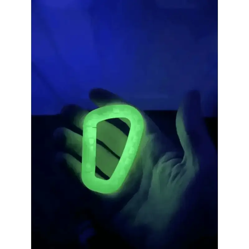 Glowing green carabiner in hand, perfect for First Responders using Williams Wedge