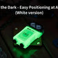 Glowing green Wuben X3 Beacon All-in-One Flashlight + Charging Dock in white casing