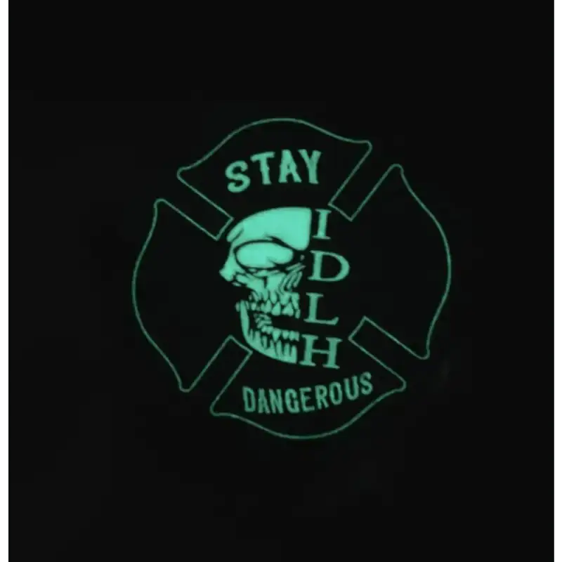 Glowing green skull design in Maltese cross on PVC Glow Patch with Stay Dangerous text