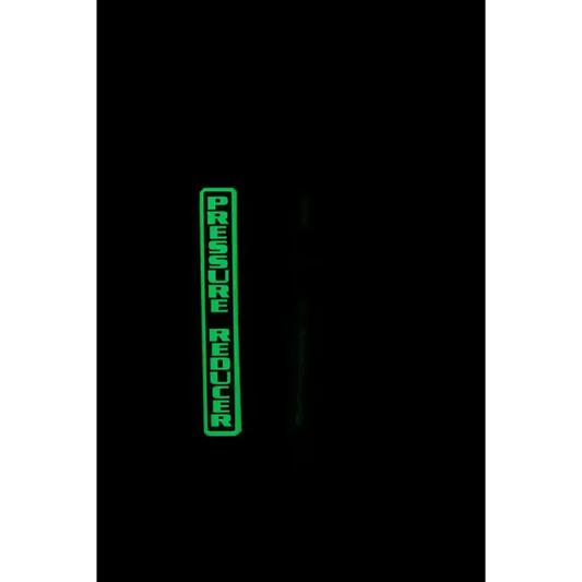 Glowing green IdentifiFire Pressure Reducer decal for 3M Scott Air-Pak SCBA in darkness