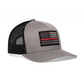 Grey and black trucker hat featuring American flag patch with thin red line design