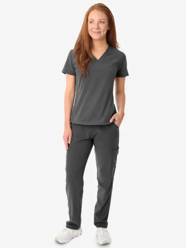 Grey women’s stash-pocket scrub uniform featuring a v-neck top and matching pants