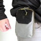 Grey waist pouch pocket organizer with black velcro flap and green zipper for first responders