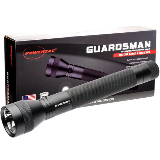 Black tactical flashlight with textured grip and packaging for Guardsman 3000 Lumen Patrol Flashlight