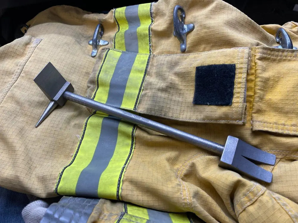 Halligan tool on firefighter gear showcasing the 12’’ XL Ti Hooligan Forced Entry Tool