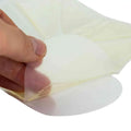Hand peeling adhesive film from Line2Design Chest Seal for open chest wound care