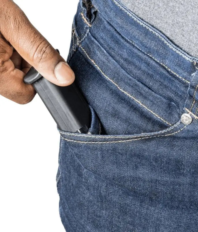 Hand removing a wallet from the pocket of Asset Tactical Jeans made for modern use