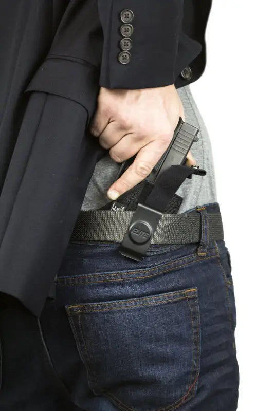 Handgun in Inside the Pant Clip Holster, under black suit jacket, ideal for Sig Sauer