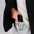 Handgun in hand pocket of Tactical Jacket Bravo for concealed carry safety