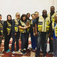 Group of people wearing HCPHES safety vests for enhanced visibility and safety