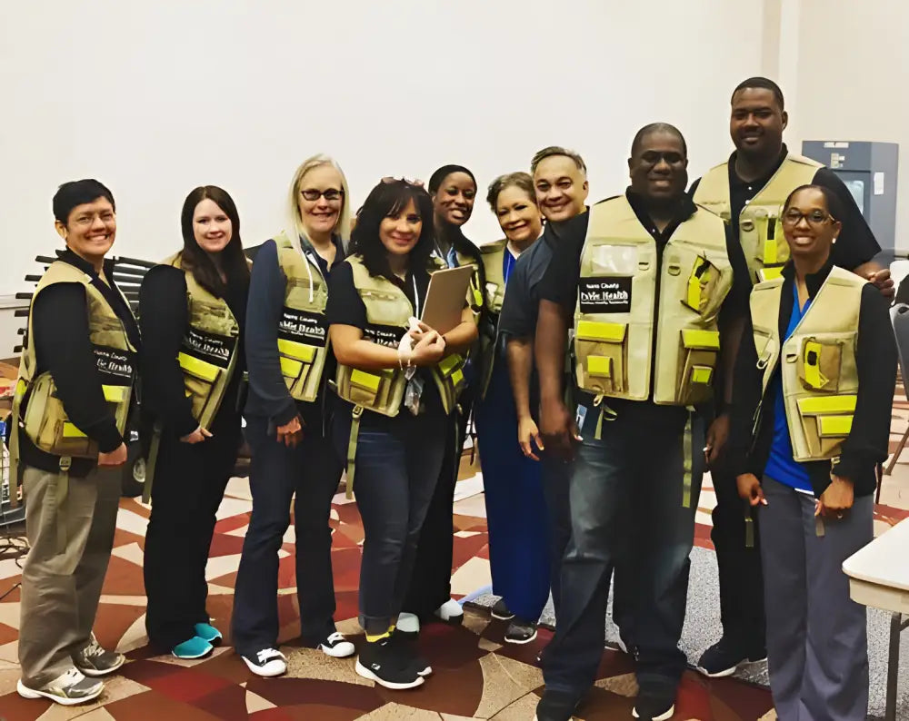 Group of people wearing HCPHES safety vests for enhanced visibility and safety