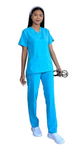 Healthcare worker in Women’s Gentle Stretch Slim Fit Zipper Set in bright blue scrubs