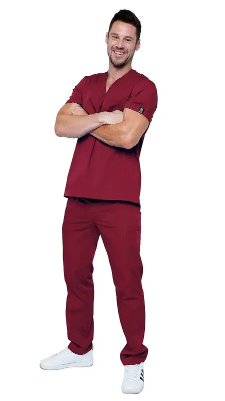 Healthcare worker in burgundy classic uniform scrubs with white sneakers, Style 101