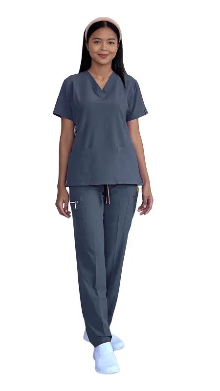 Healthcare worker in gray-blue scrubs from Women’s Gentle Stretch Slim Fit Zipper Set