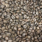 Heap of medium-roast coffee beans from Southern Star Bourbon Infused Costa Rica