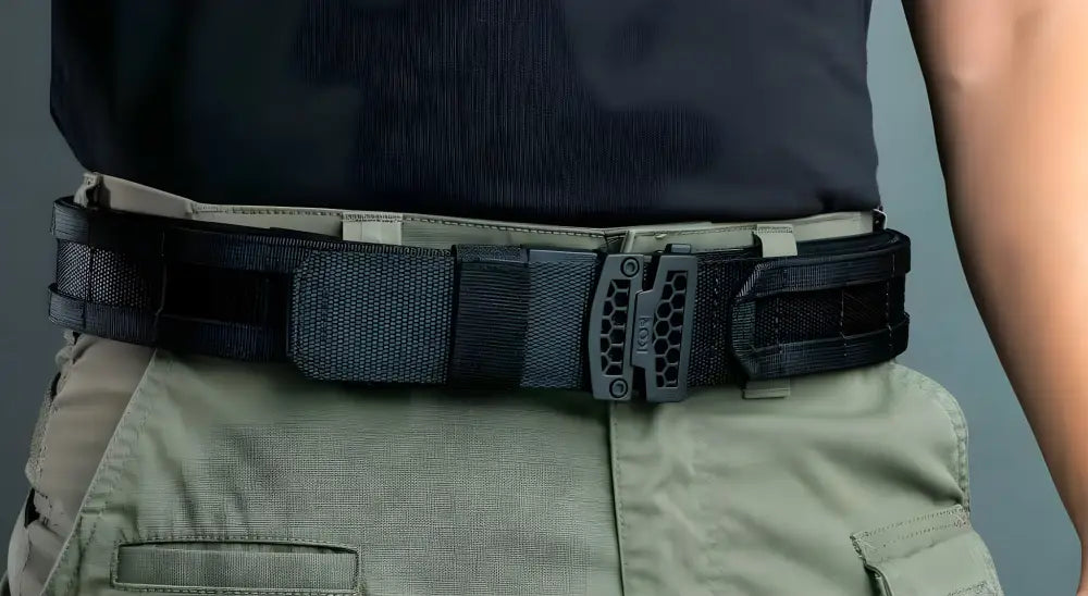 Heavy-duty tactical belt with robust buckle over khaki pants in Multicam Black Complete Kit