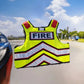 High-visibility yellow ballistic vest with FIRE text and reflective stripes for safety