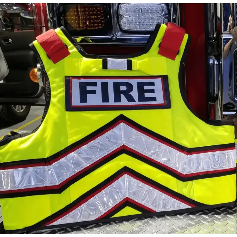 High-visibility yellow ballistic vest with FIRE text and reflective stripes for safety