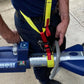 Hydraulic rescue tool Jaws of Life with blue and yellow components in Extrication Tool Carrying Strap